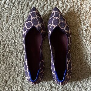 Rothy’s giraffe print. Purple with pink background size 11.